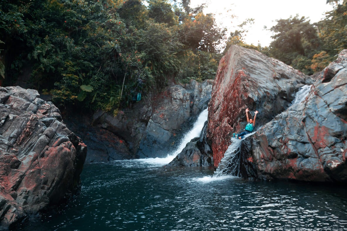 Swimming in a natural pool below an El Yunque waterfall